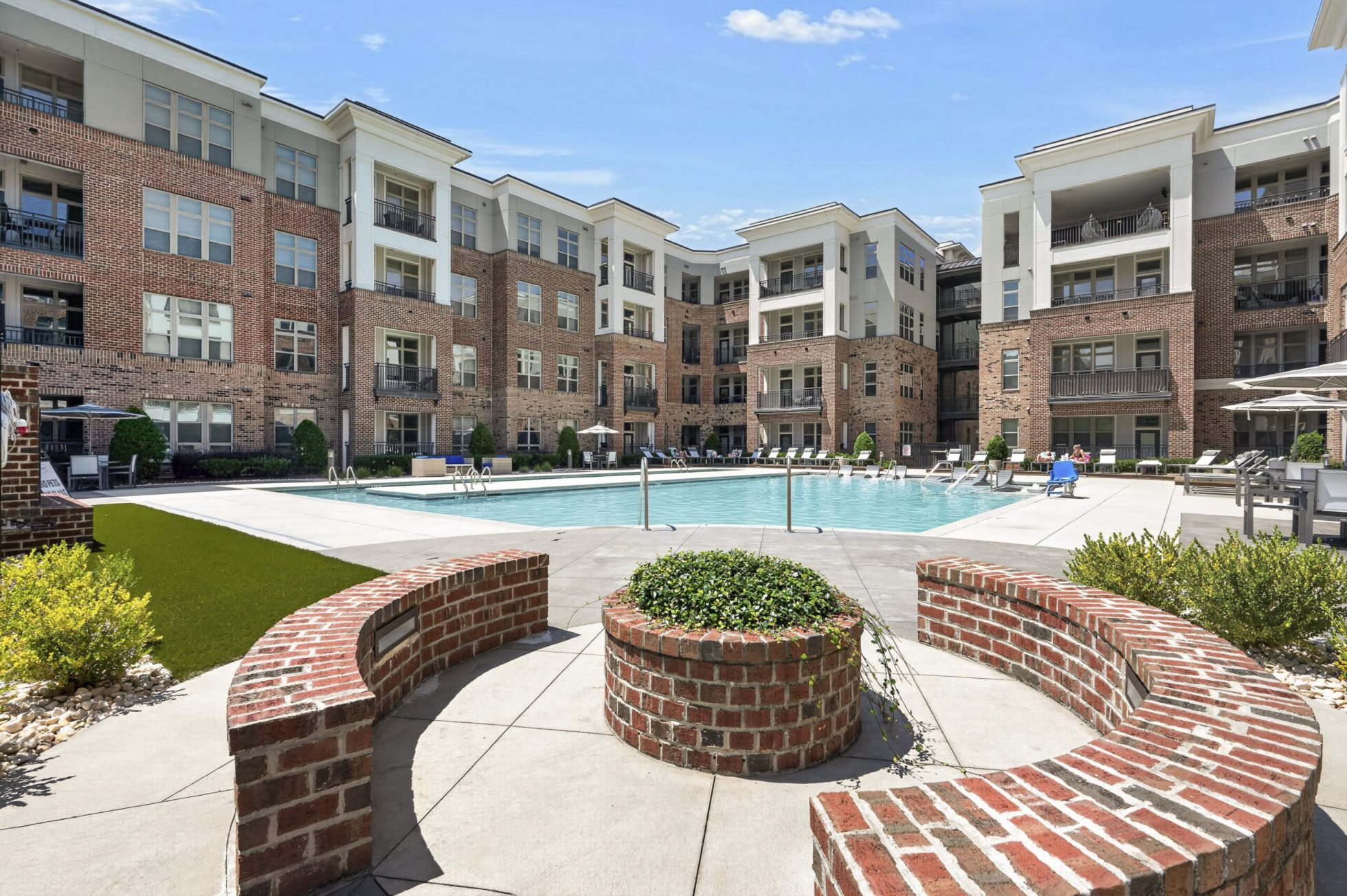 Onsite beer garden amenity for residents with lots of seating and a large outdoor lawn