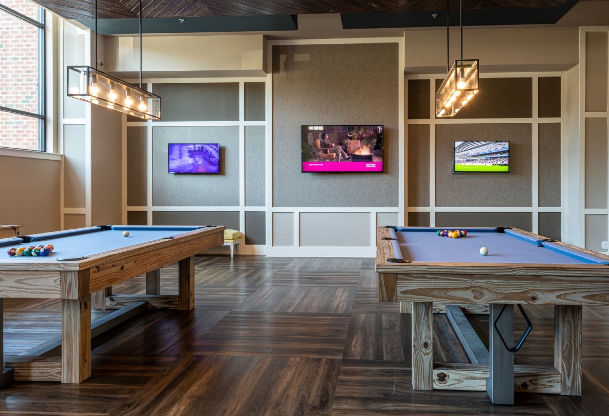 Fully furnished game room with billiards and TVs