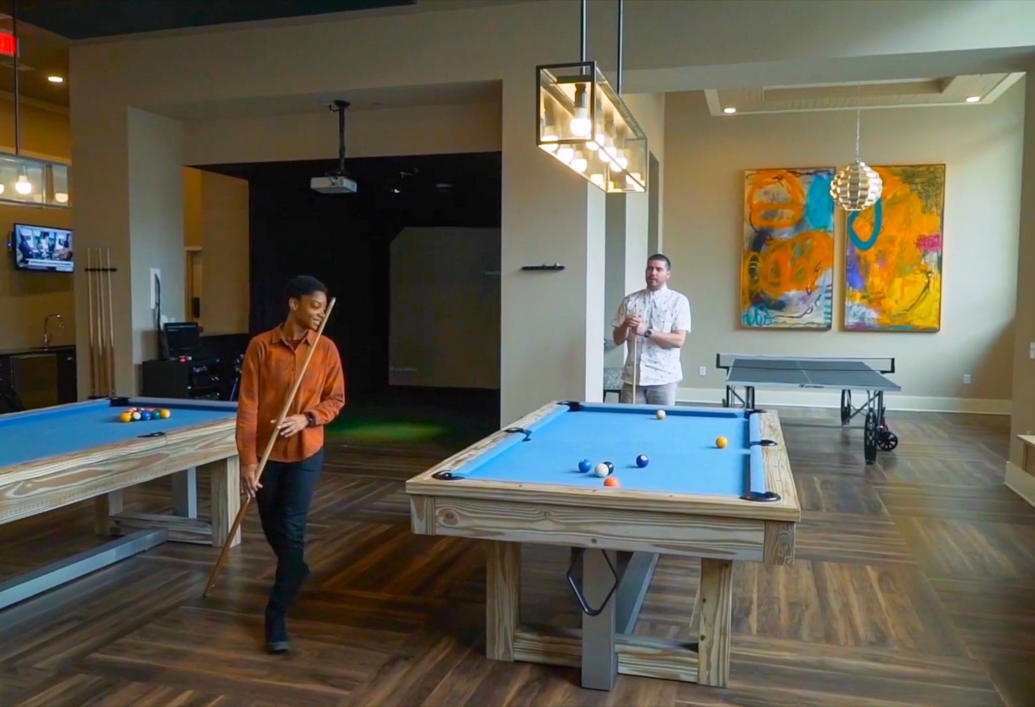 Fully furnished game room with billiards and TVs