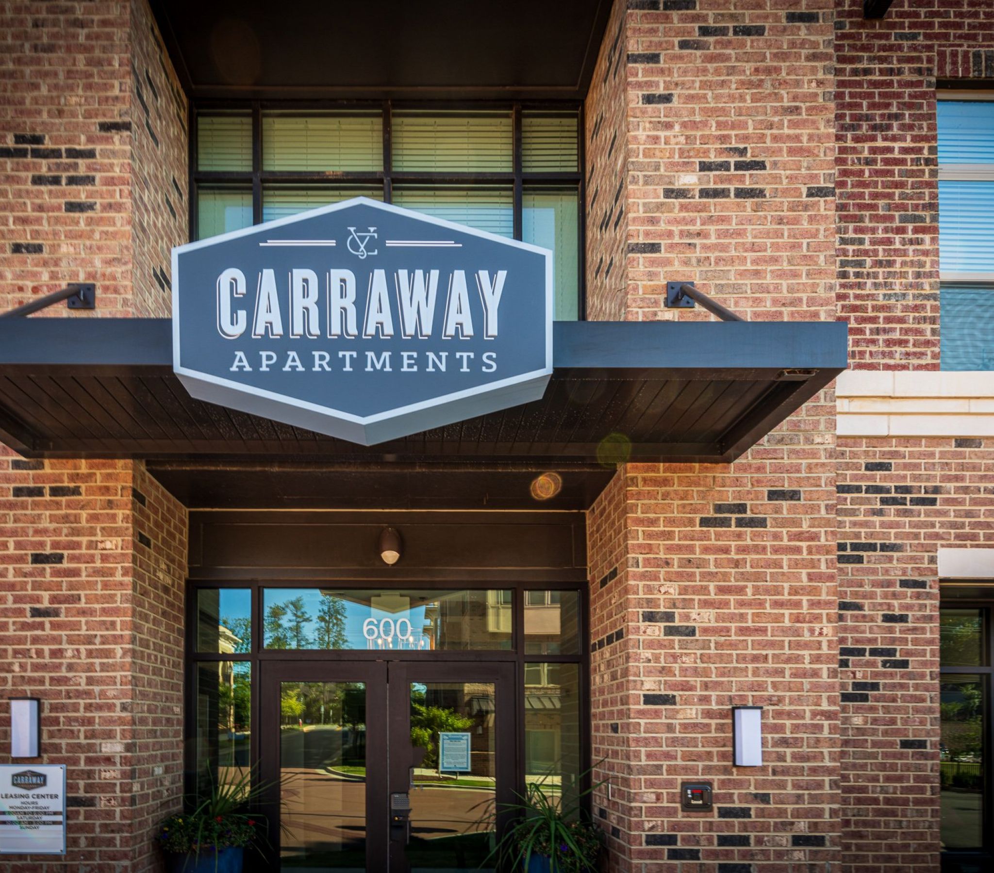 Carraway Village Apartments exterior sign and entrance