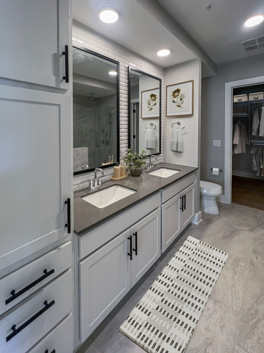 Carraway Village spacious bathroom with double sinks, walk-in closet, and built-in storage