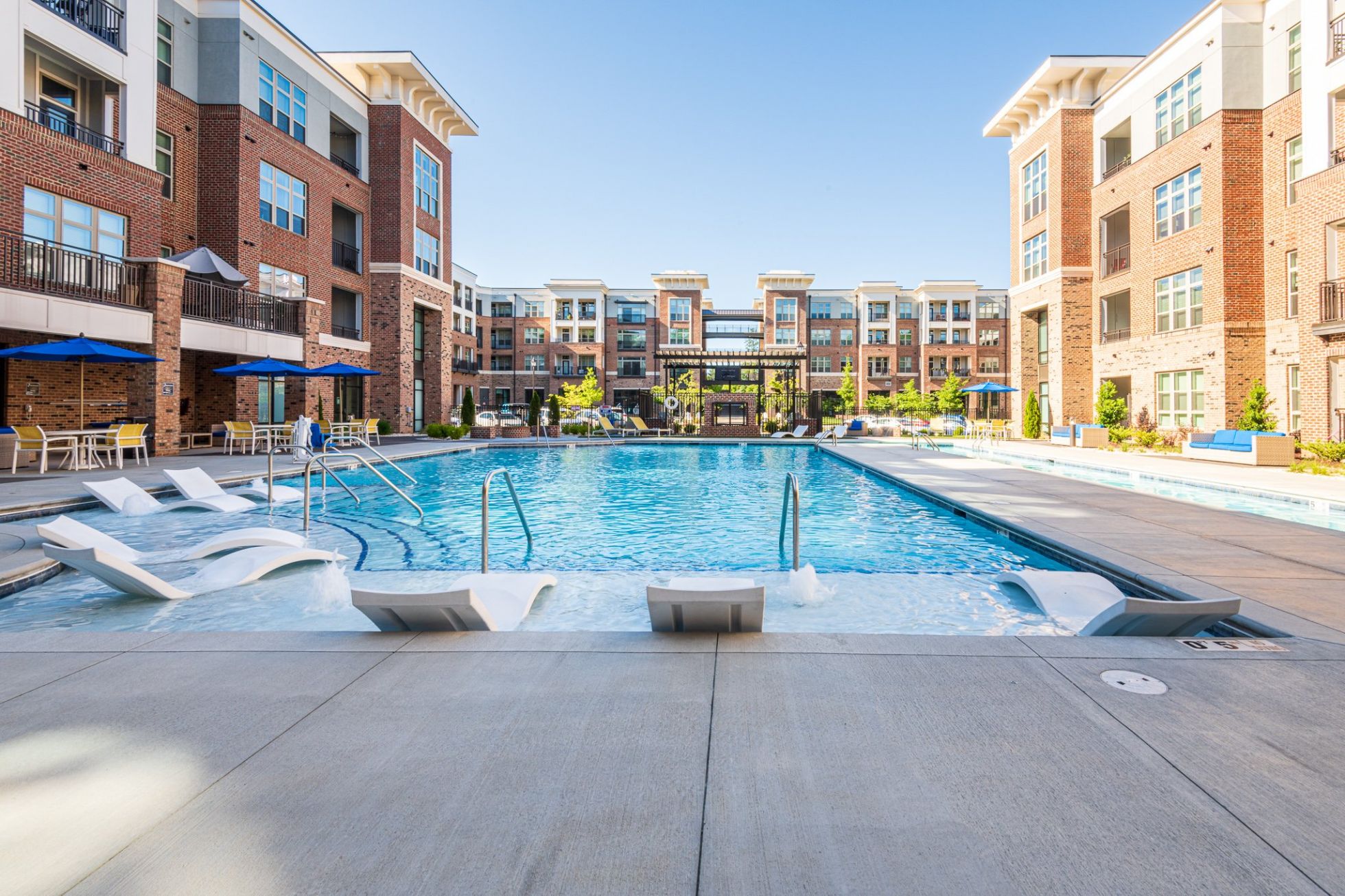apartment building with luxury outdoor pool