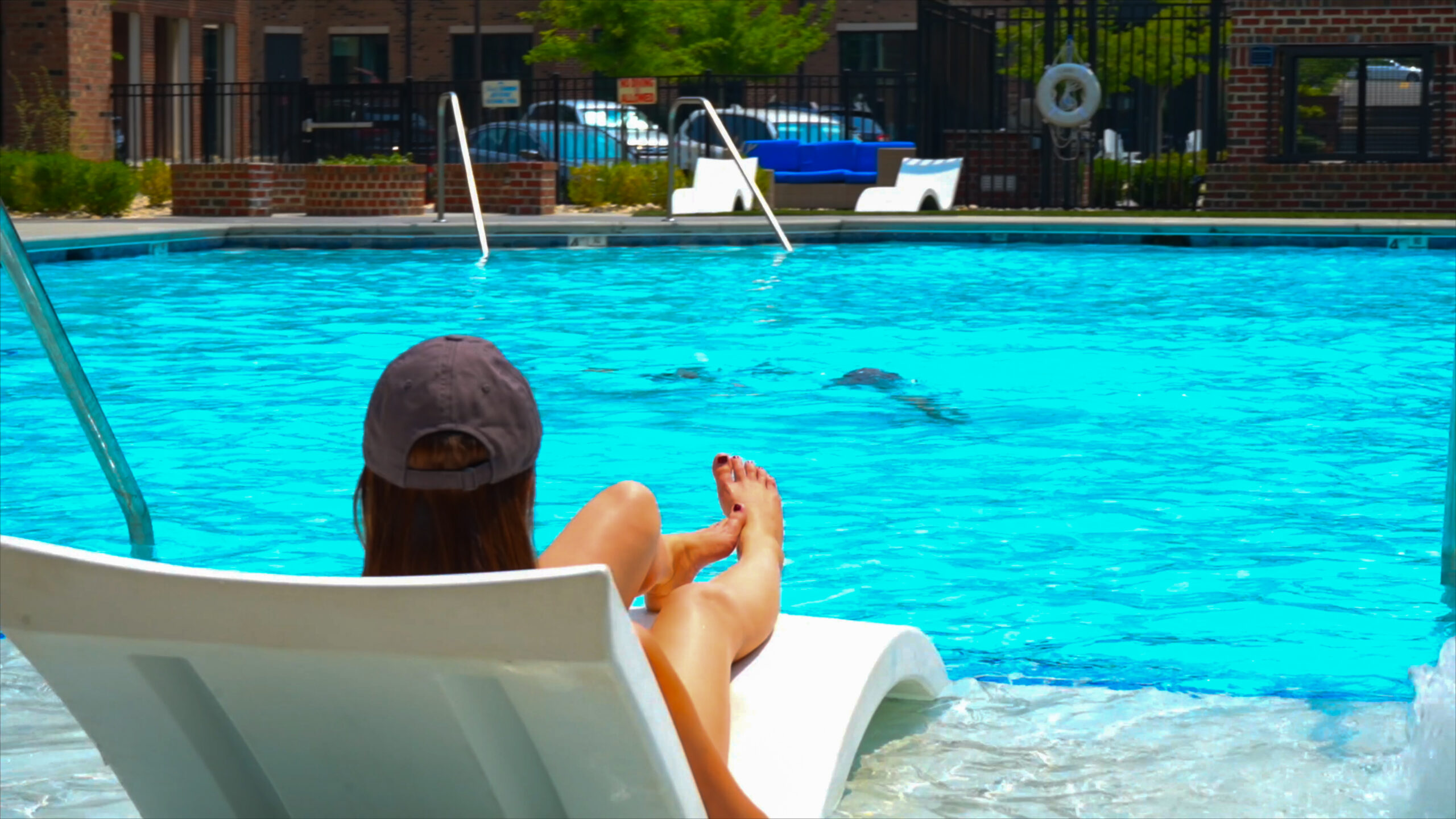 Outdoor pool amenity at Carraway Village with lounge chairs