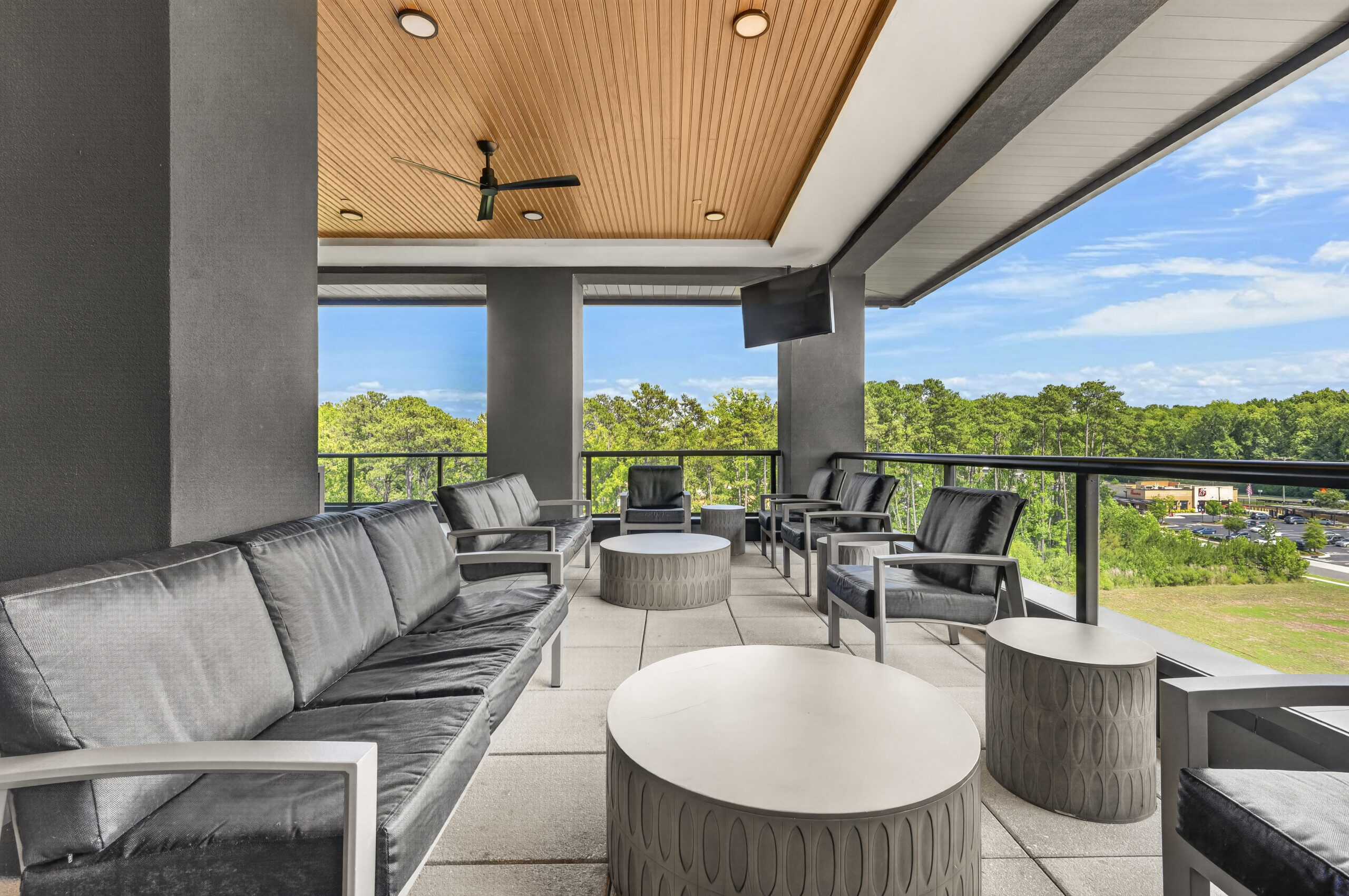 Billiards table and shuffleboard table inside game room amenity at Carraway Village Apartments in Chapel Hill, NC