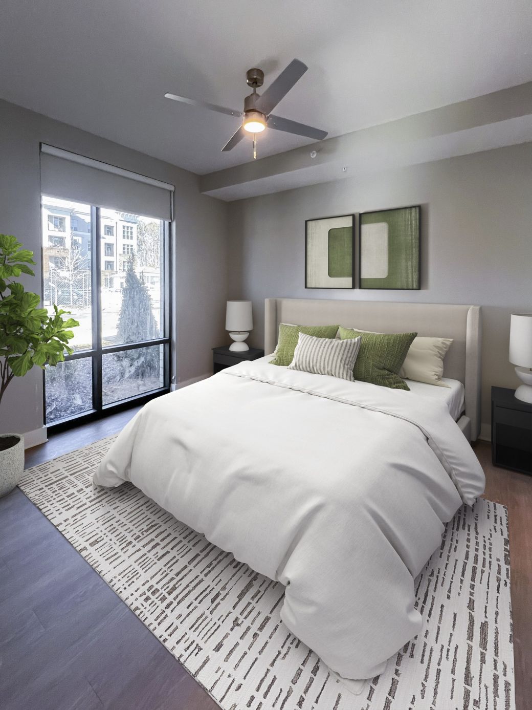 Carraway Village spacious apartment bedroom with large bed, windows, and ceiling fan