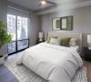Carraway Village spacious apartment bedroom with large bed, windows, and ceiling fan