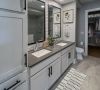 Carraway Village spacious bathroom with double sinks, walk-in closet, and built-in storage