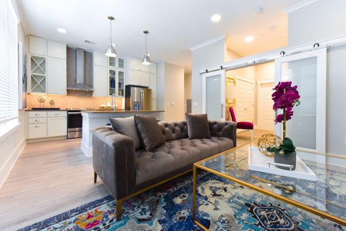 Studio apartment with sliding barn doors and open concept layout