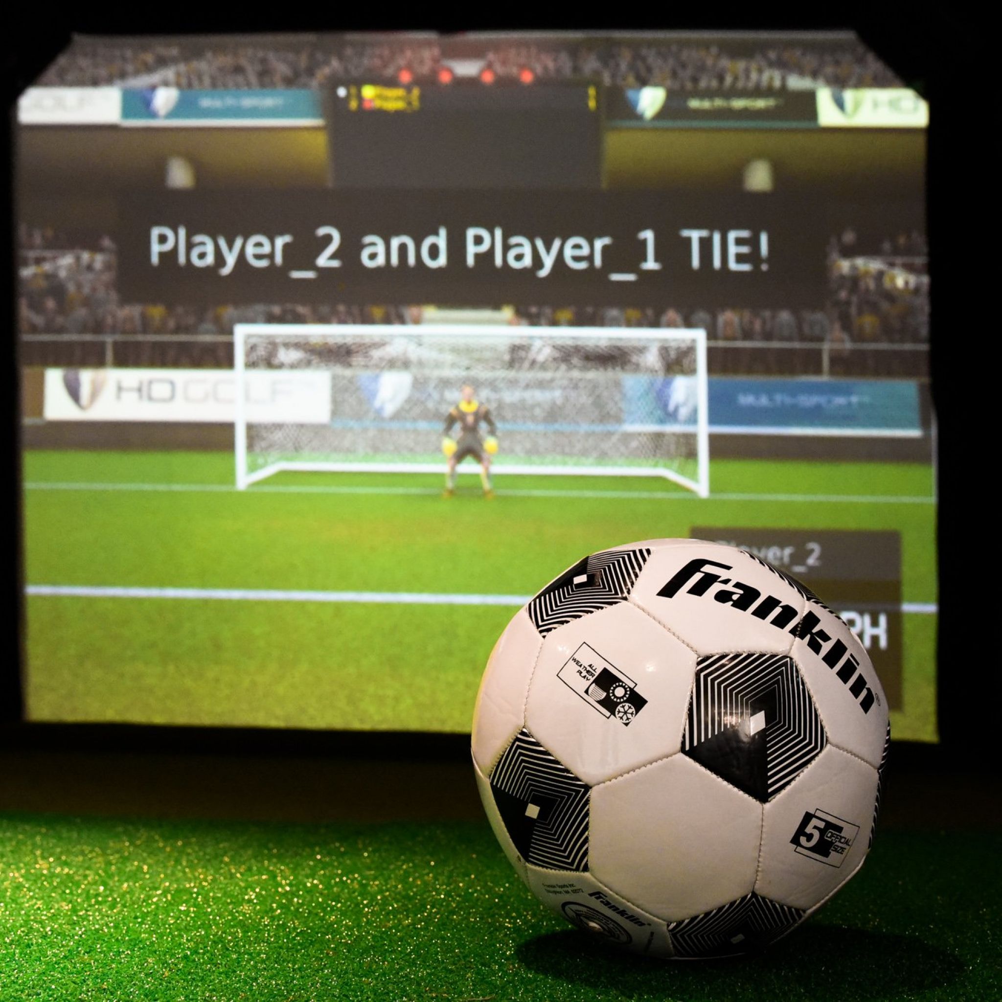 VR sports simulator with soccer ball laying in front