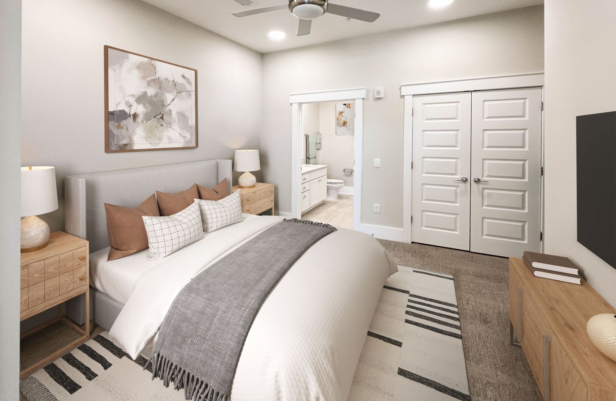 1-bed apartment bedroom with large bed, ceiling fan, carpet, dresser, and large closet